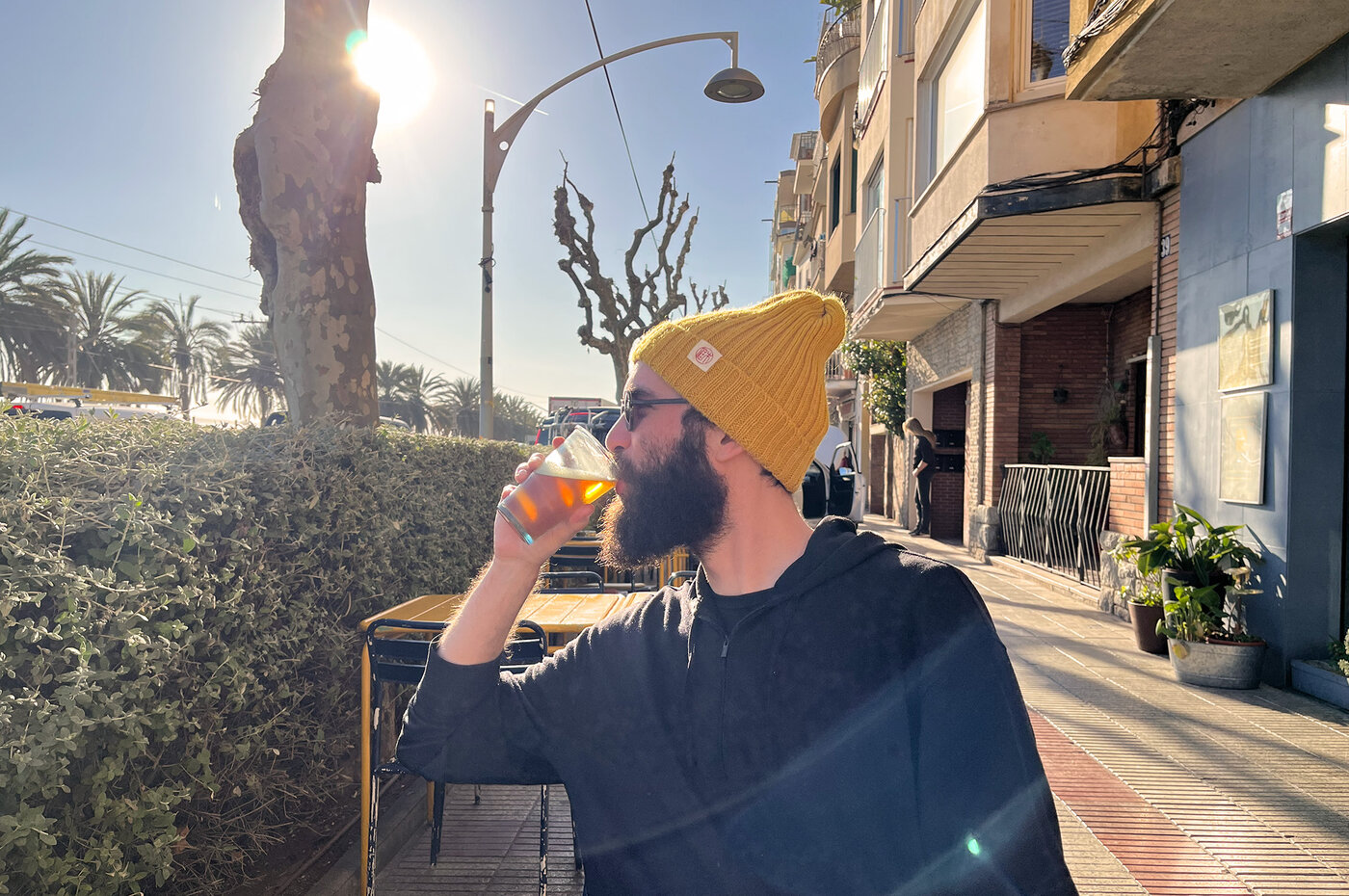 sampi drinking beer in his ridiculous hat that he loves
